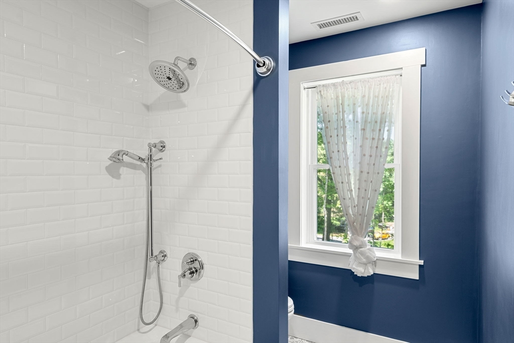 158 Warren Road Townsend, MA 01469 - Photo 31 of 41 a bathroom with a window and a shower