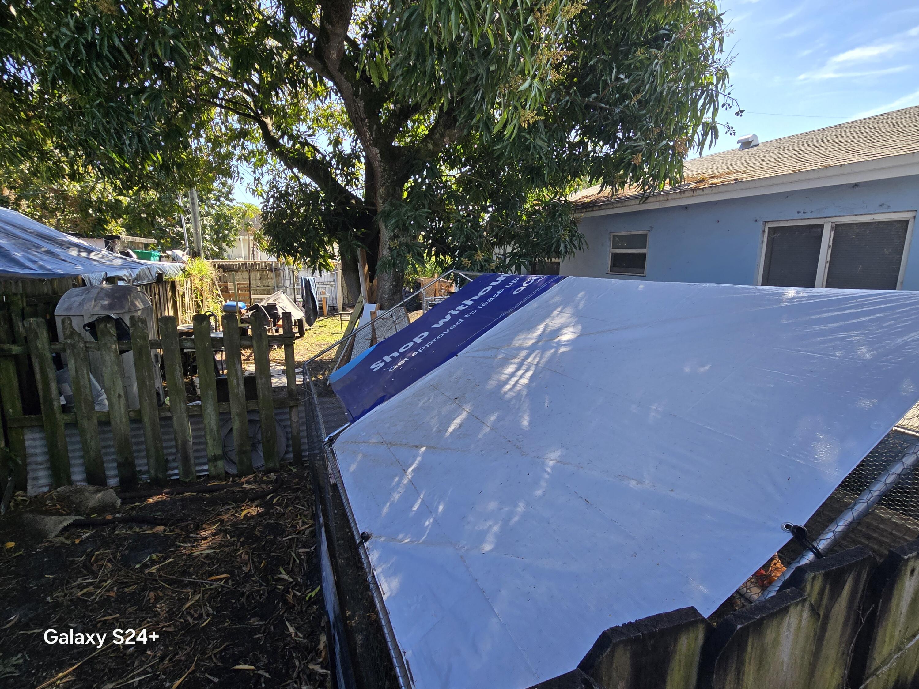 4258 Coconut Road Lake Worth, FL 33461 - Photo 13 of 14 a view of a house with a yard