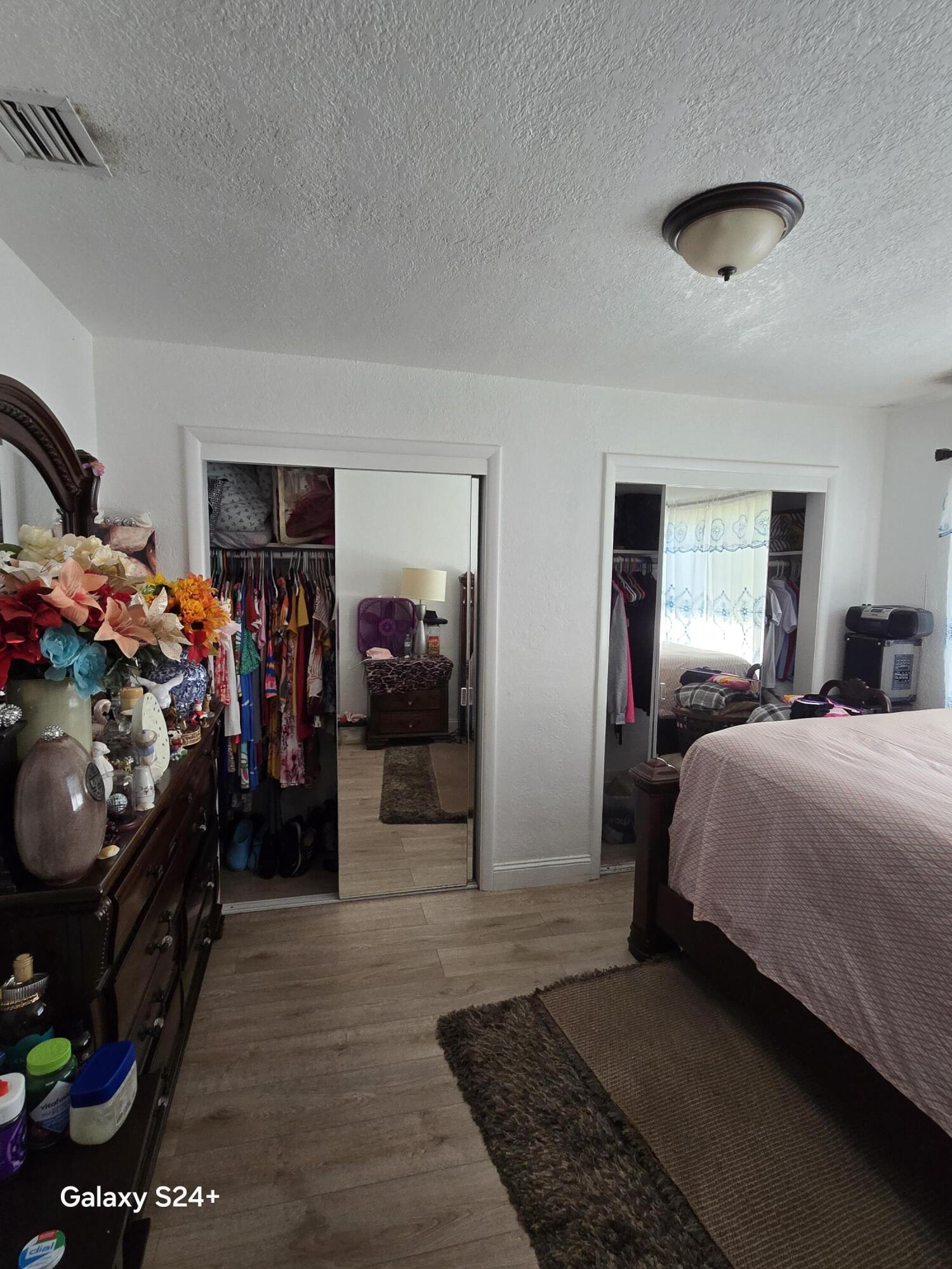 4258 Coconut Road Lake Worth, FL 33461 - Photo 9 of 14 a bedroom with bed and a window