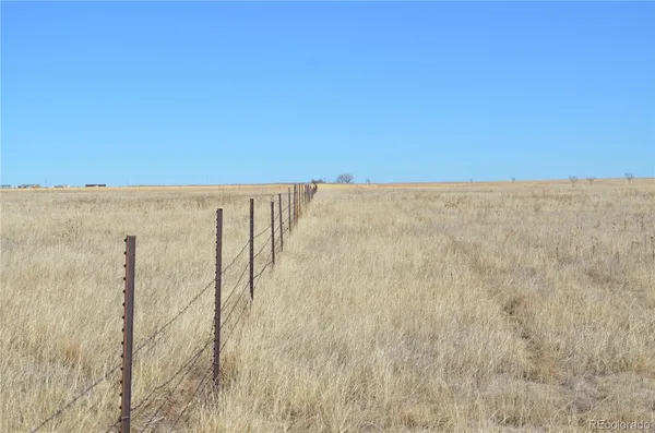 a view of small space with wooden fence