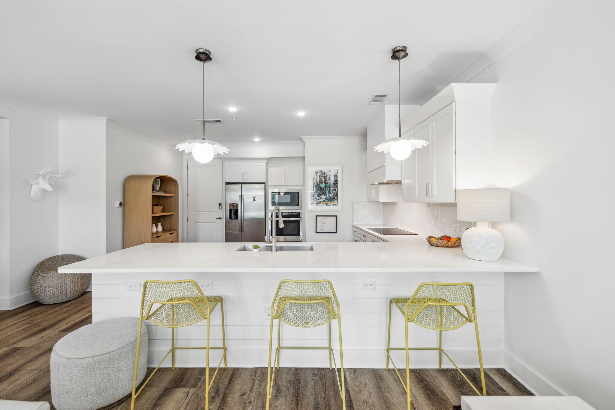 a large kitchen with a table and chairs