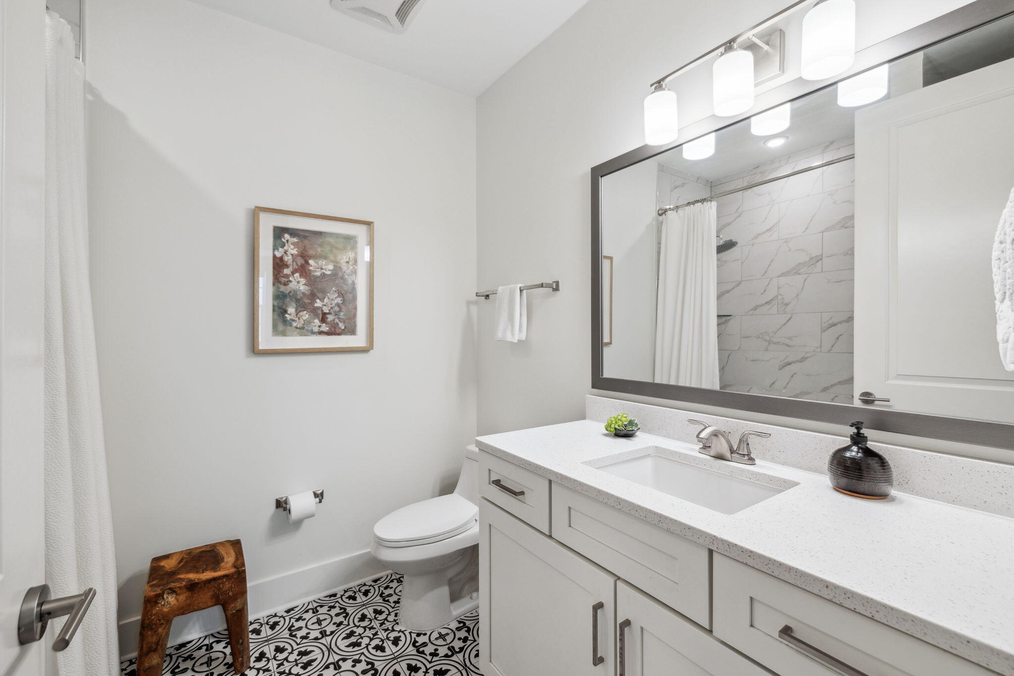 179 South County Highway 393, Unit 327 Santa Rosa Beach, FL 32459 - Photo 15 of 31 a bathroom with a sink toilet and a mirror