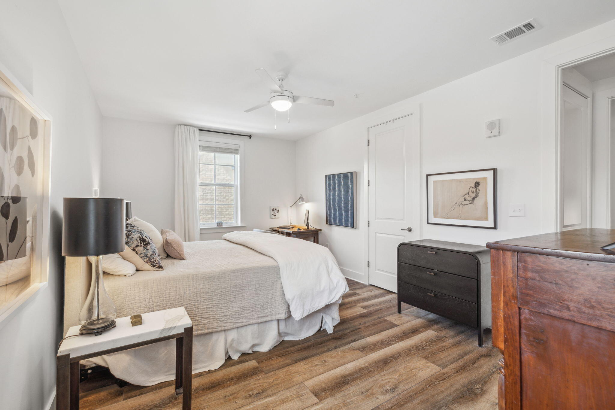 179 South County Highway 393, Unit 327 Santa Rosa Beach, FL 32459 - Photo 18 of 31 a bedroom with a bed and wooden floor