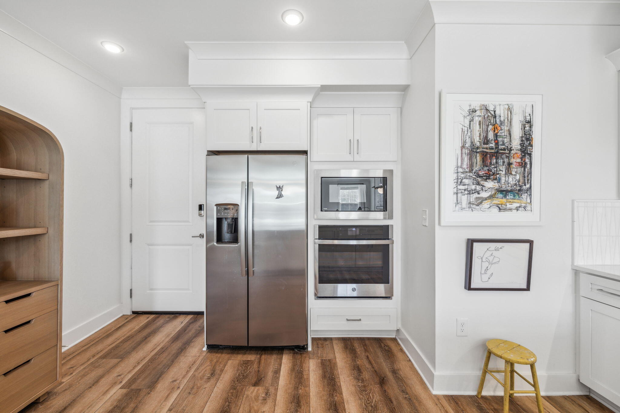 179 South County Highway 393, Unit 327 Santa Rosa Beach, FL 32459 - Photo 6 of 31 a kitchen with stainless steel appliances a refrigerator and wooden floor