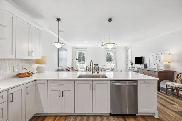 a kitchen with sink stove and cabinets