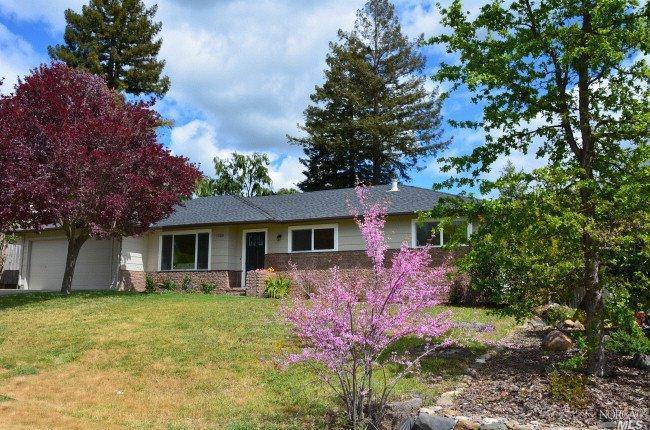 1520 St Francis Road Santa Rosa, CA 95409 - Photo 1 of 1 a front view of house with yard and green space