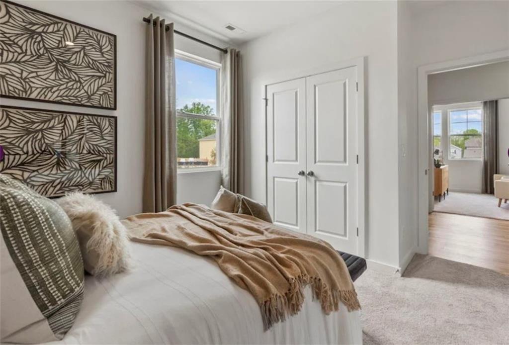 74 Poplar Blf Way Jefferson, GA 30549 - Photo 20 of 32 a bedroom with a bed and a window