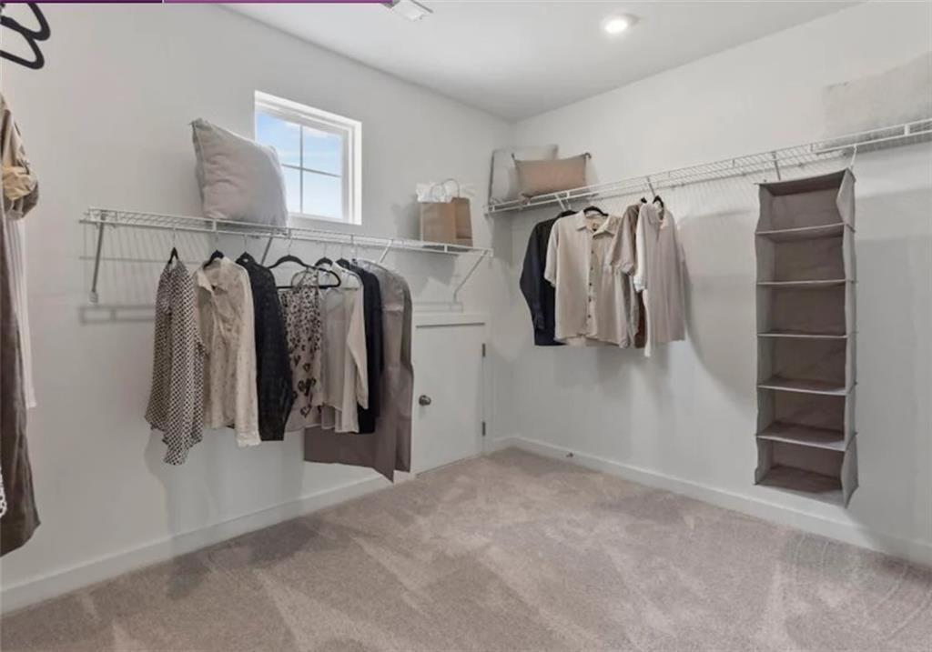 74 Poplar Blf Way Jefferson, GA 30549 - Photo 26 of 32 a view of walk in closet with clothes and shoes