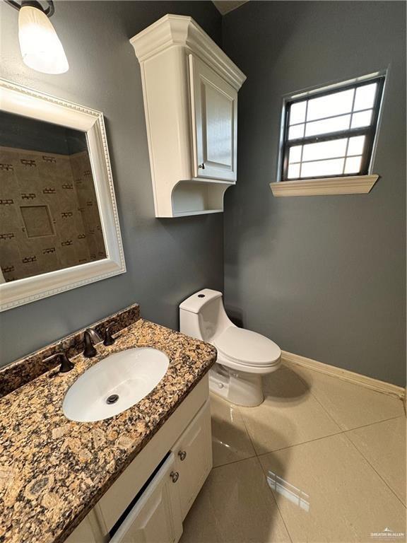 1216 East Balboa Avenue McAllen, TX 78503 - Photo 12 of 16 a bathroom with a granite countertop sink and a mirror