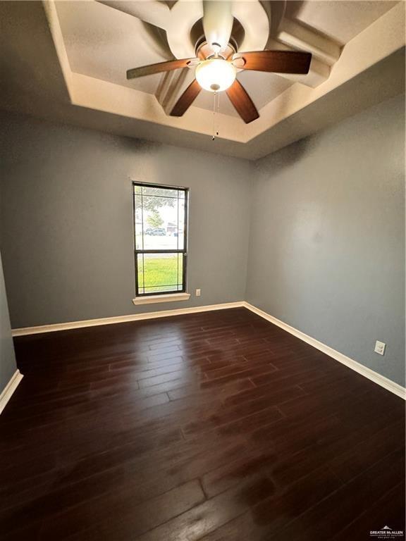 1216 East Balboa Avenue McAllen, TX 78503 - Photo 7 of 16 an empty room with wooden floor and windows