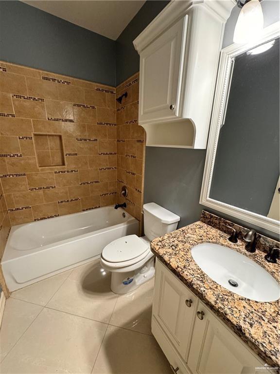 1216 East Balboa Avenue McAllen, TX 78503 - Photo 8 of 16 a bathroom with a granite countertop toilet sink and mirror