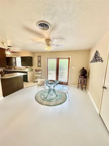 a dining room with kitchen island granite countertop furniture and a fireplace