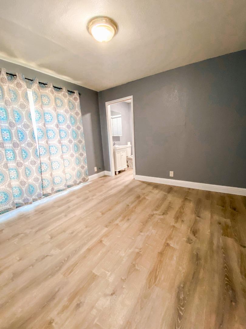 6152 Baker Street Oakland, CA 94608 - Photo 18 of 23 a view of an empty room with a window