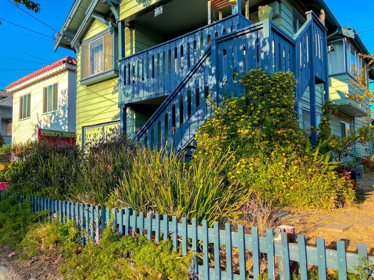 6152 Baker Street Oakland, CA 94608 - Photo 22 of 23 a view of a brick house with wooden fence