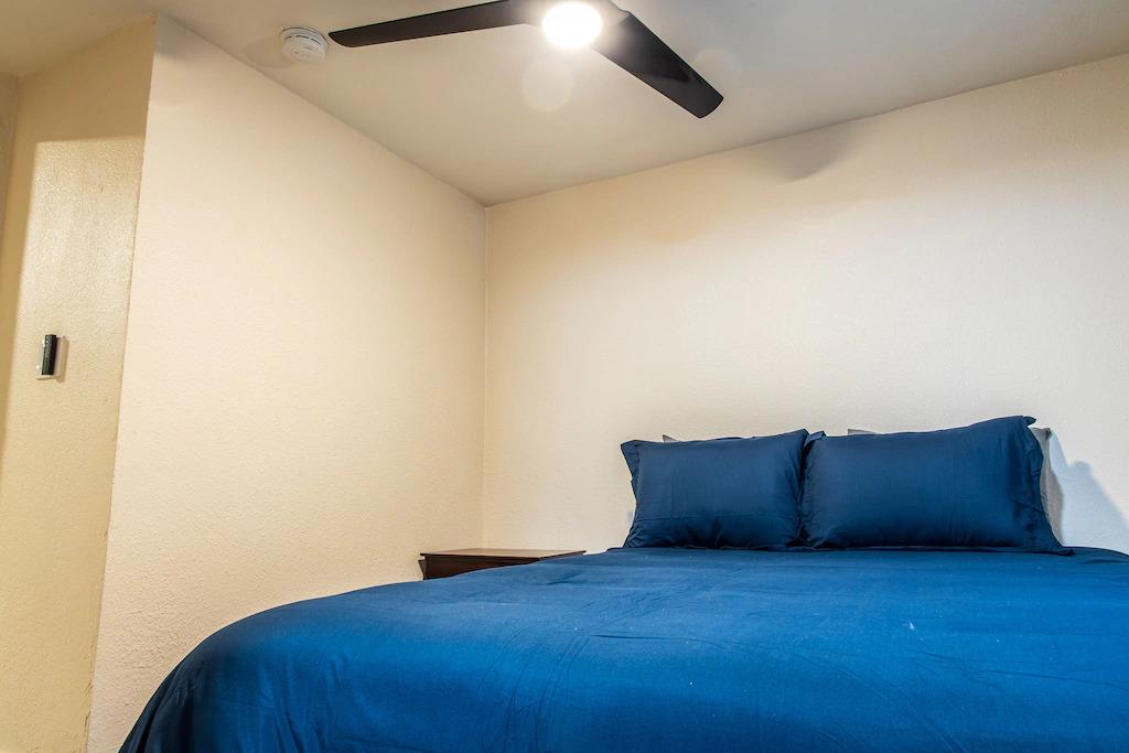 6152 Baker Street Oakland, CA 94608 - Photo 9 of 23 a room with a bed