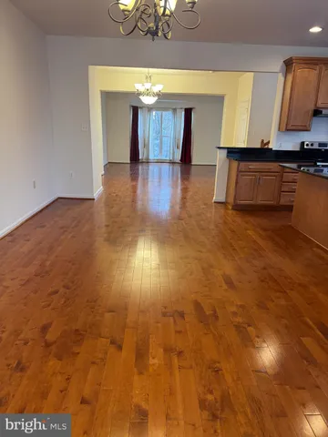 a backyard of a house with large trees