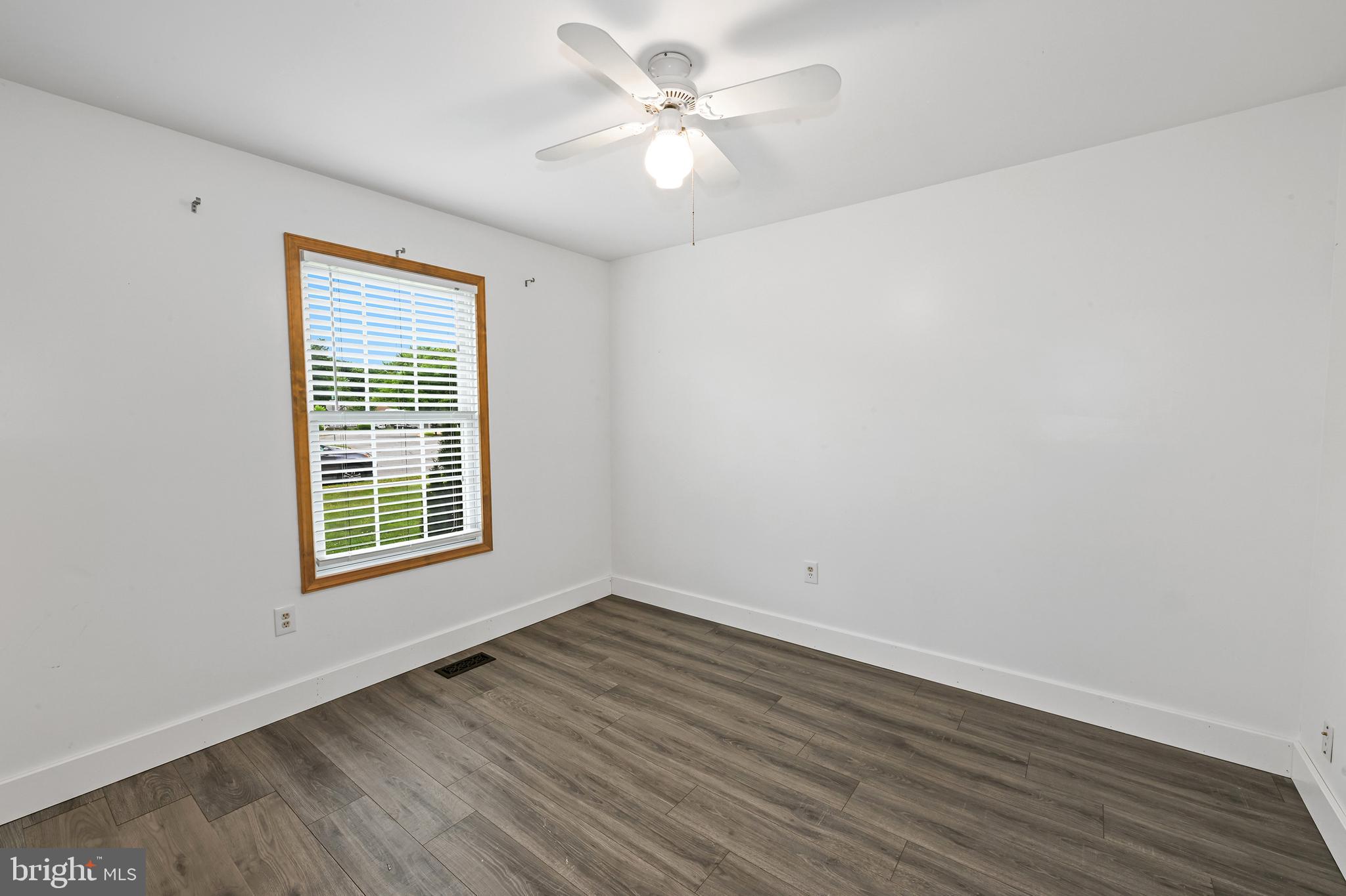 10303 Abbott Road Manassas, VA 20110 - Photo 21 of 36 wooden floor in an empty room with a window
