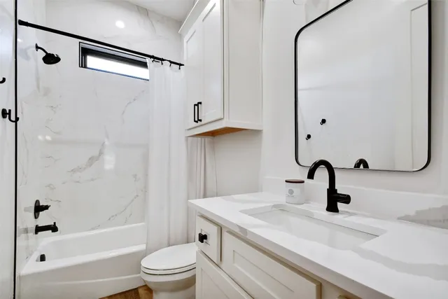 a view of a hallway with washer and dryer