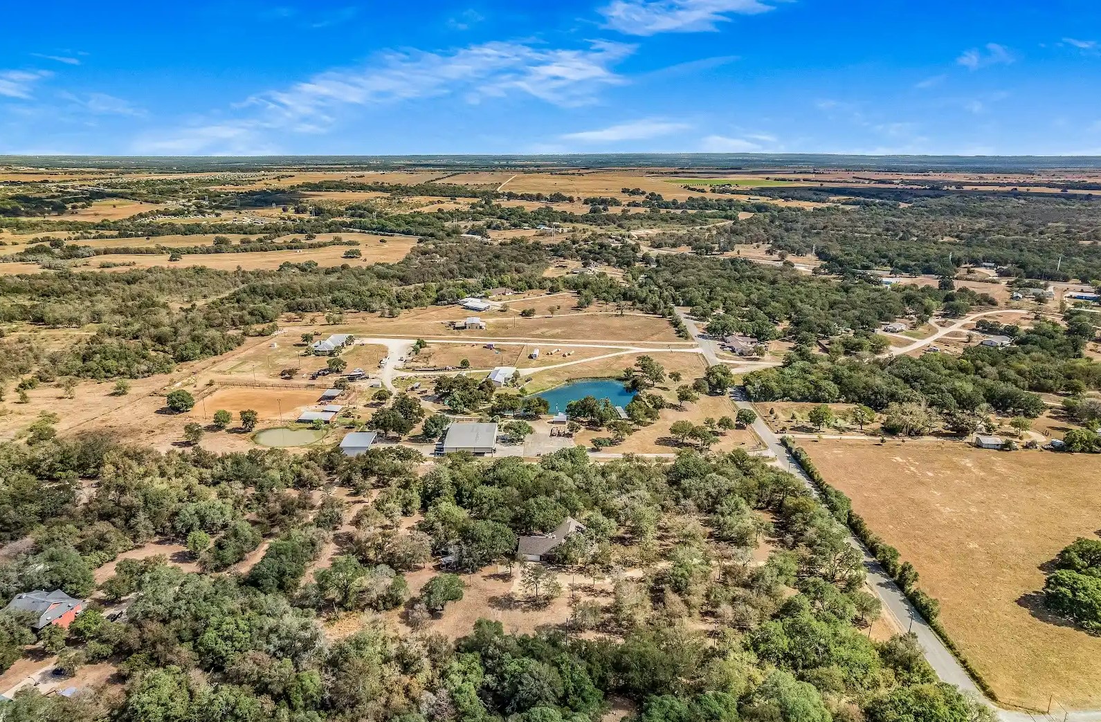 486 Westwood Road Lockhart, TX 78644 - Photo 23 of 29 Aerial view of property and surrounding area featuring rural landscape