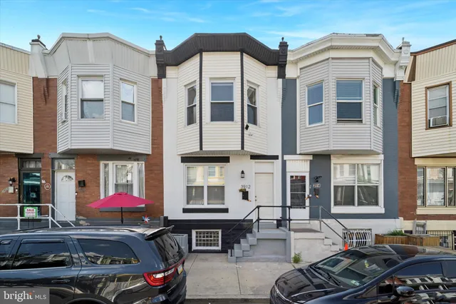 a front view of a building with outdoor space