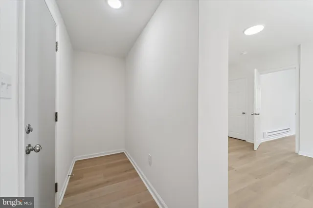 a view of hallway with closet