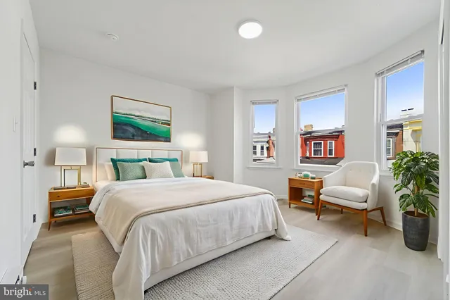 a bedroom with a bed and a couch