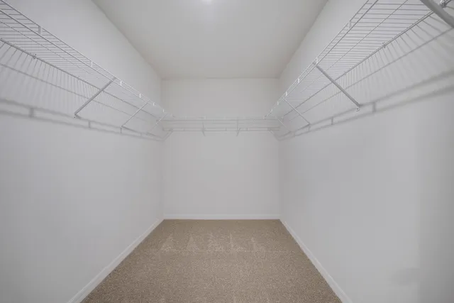 a view of a big room with windows