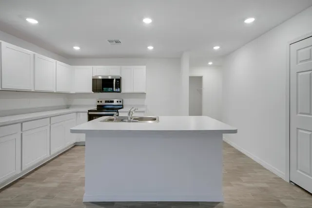 a view of hallway with a white wall