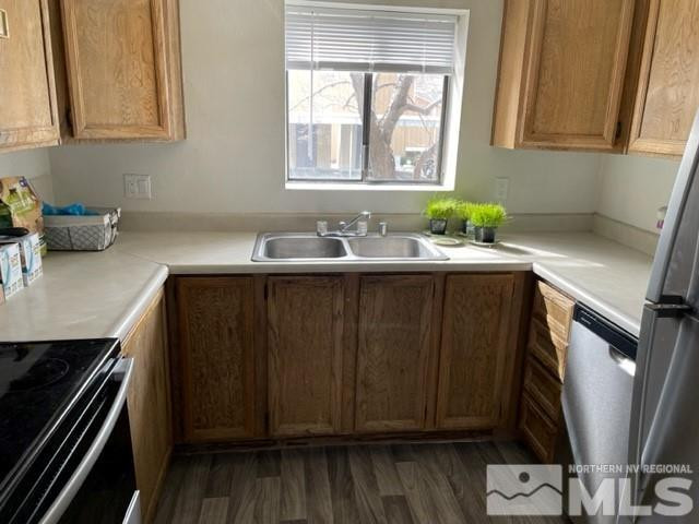 147 Vista Rafael Parkway Reno, NV 89503 - Photo 4 of 15 a kitchen with stainless steel appliances a sink dishwasher stove and cabinets