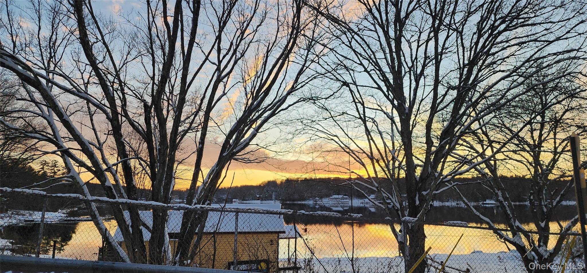 20 Hasbrouck A Road Loch Sheldrake, NY 12759 - Photo 6 of 8 a view of backyard with large trees and wooden fence