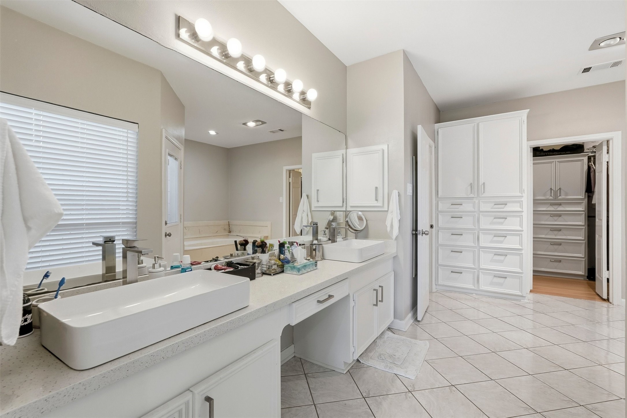 7927 Wolfield Lane Houston, TX 77071 - Photo 13 of 24 a bathroom with a sink double vanity and a shower
