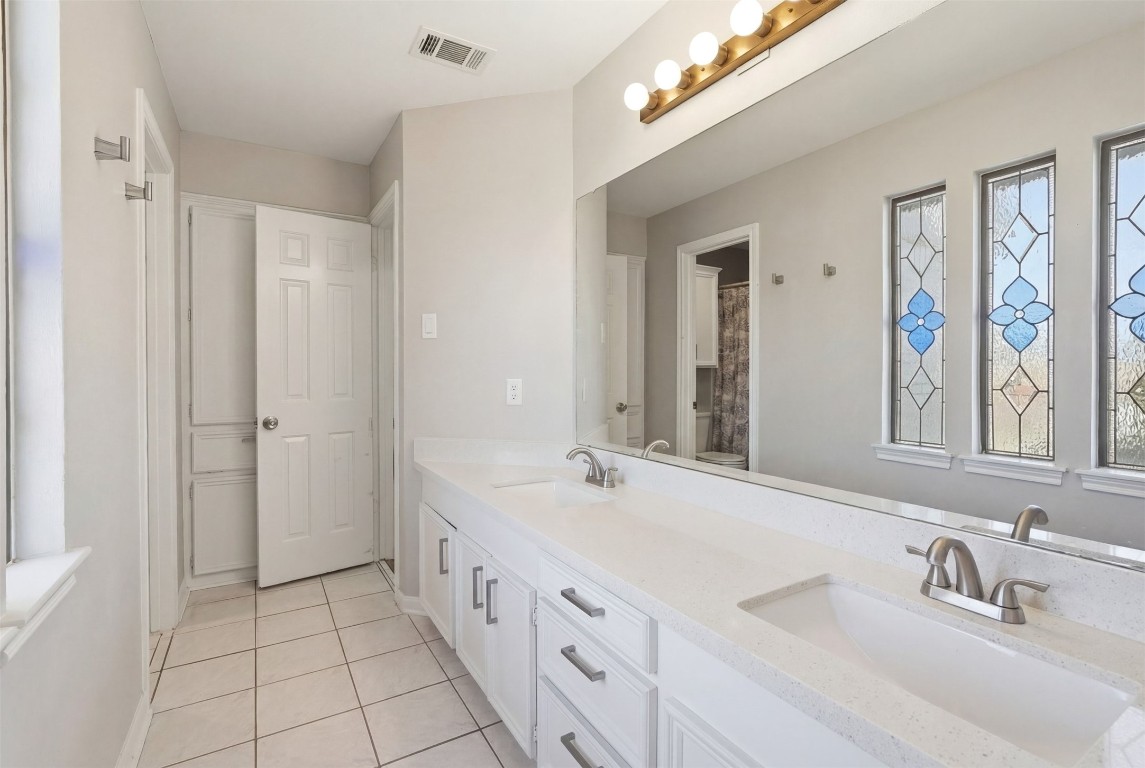 7927 Wolfield Lane Houston, TX 77071 - Photo 19 of 24 a bathroom with a double vanity sink mirror and double