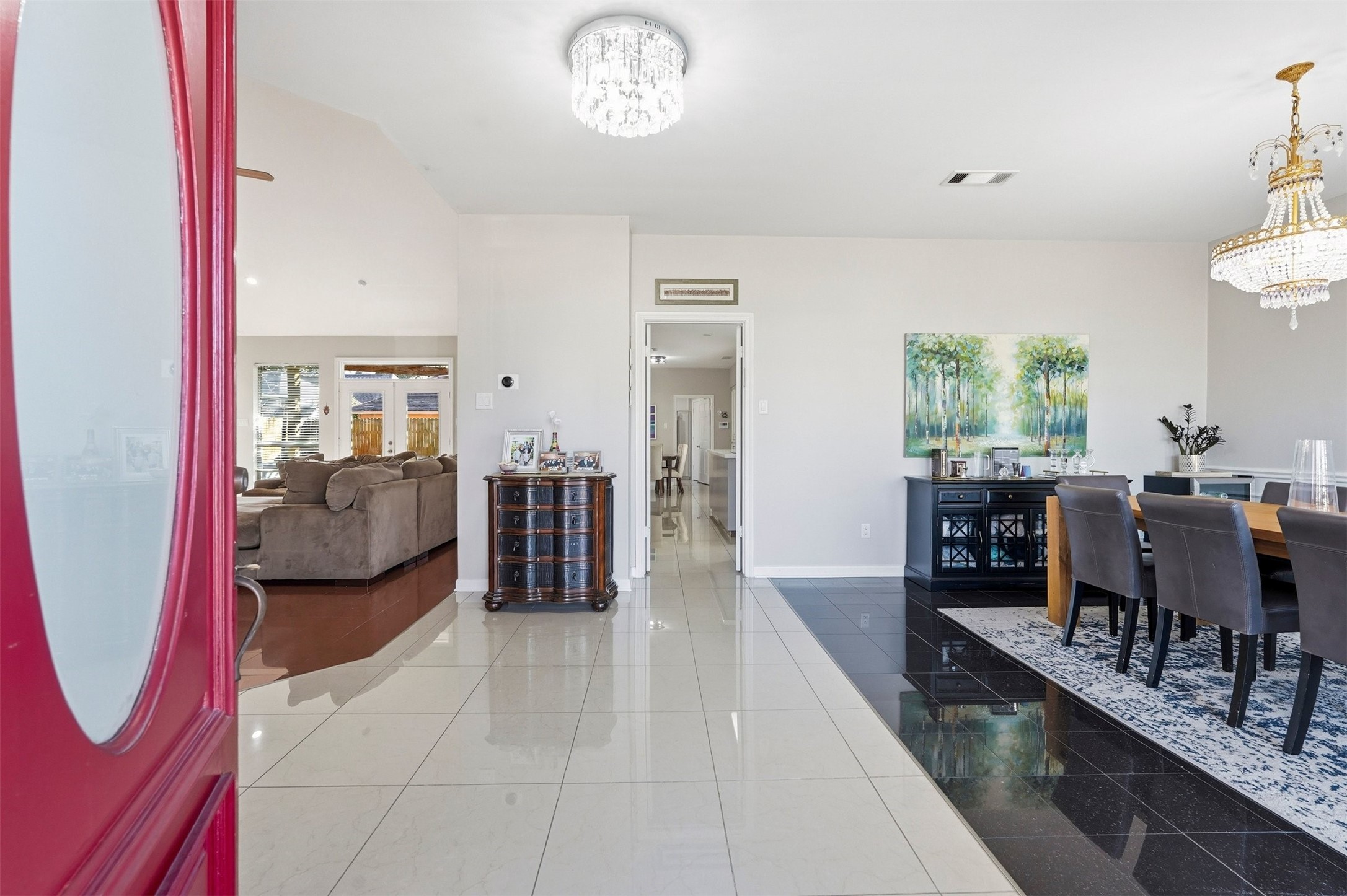 7927 Wolfield Lane Houston, TX 77071 - Photo 2 of 24 a living room with furniture and a chandelier
