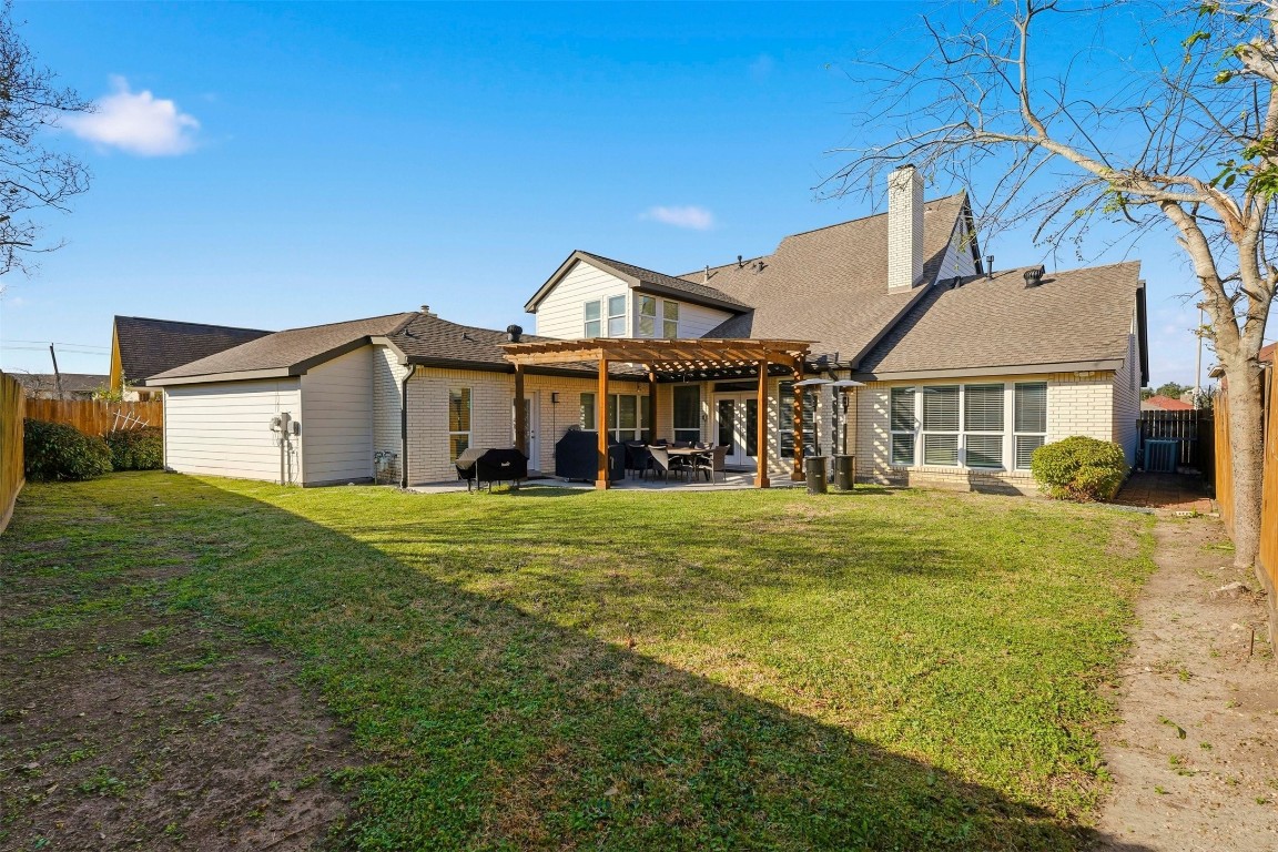 7927 Wolfield Lane Houston, TX 77071 - Photo 23 of 24 a front view of a house with a garden