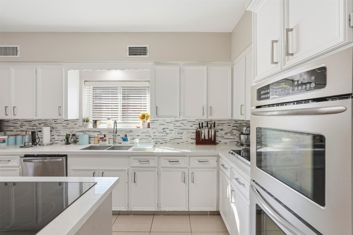7927 Wolfield Lane Houston, TX 77071 - Photo 8 of 24 a kitchen with a sink stove and cabinets