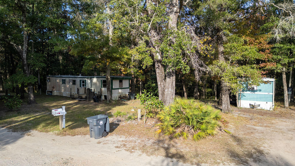 72 April Court Freeport, FL 32439 - Photo 13 of 15 a view of a backyard with large tree