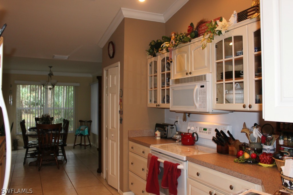 4091 Staley Road Fort Myers, FL 33905 - Photo 6 of 17 a kitchen with cabinets and window