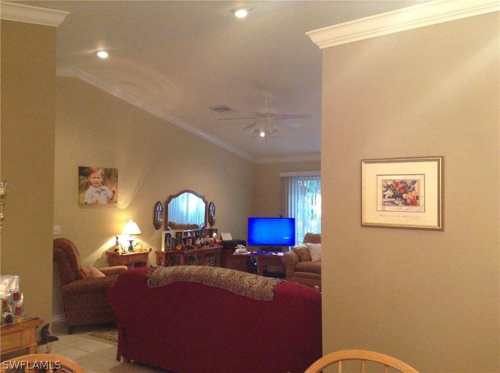 4091 Staley Road Fort Myers, FL 33905 - Photo 7 of 17 a living room with furniture and a lamp