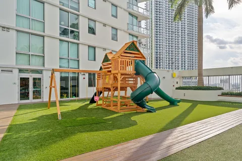 a view of a dining room with furniture and toys