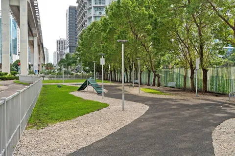 a view of a roof deck with wooden fence and a couple of chairs