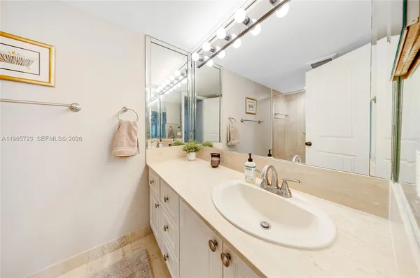 a bathroom with a double vanity sink and mirror