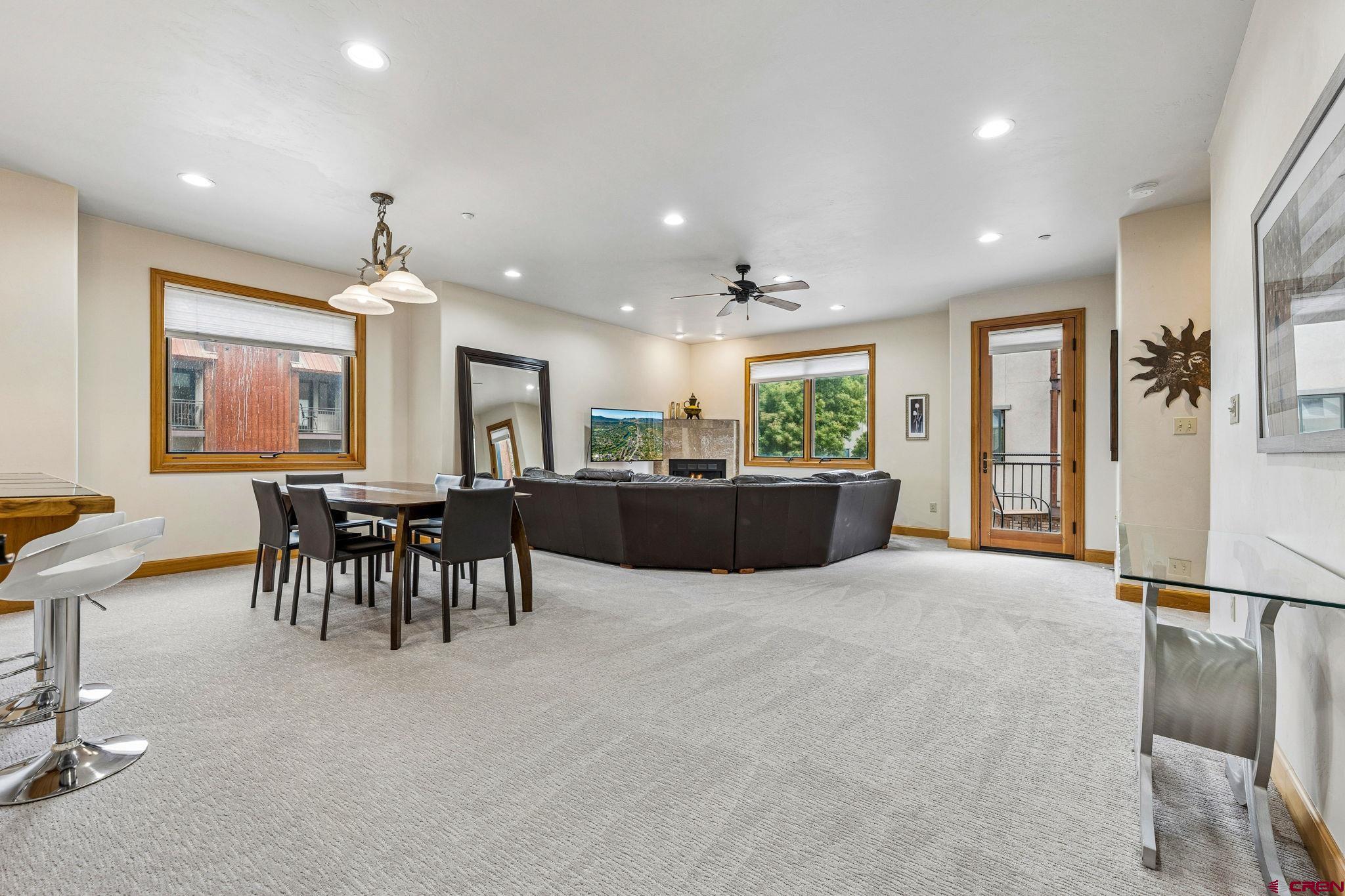 1422 Animas View Drive, Unit 55 Durango, CO 81301 - Photo 10 of 44 a large kitchen with a table and chairs