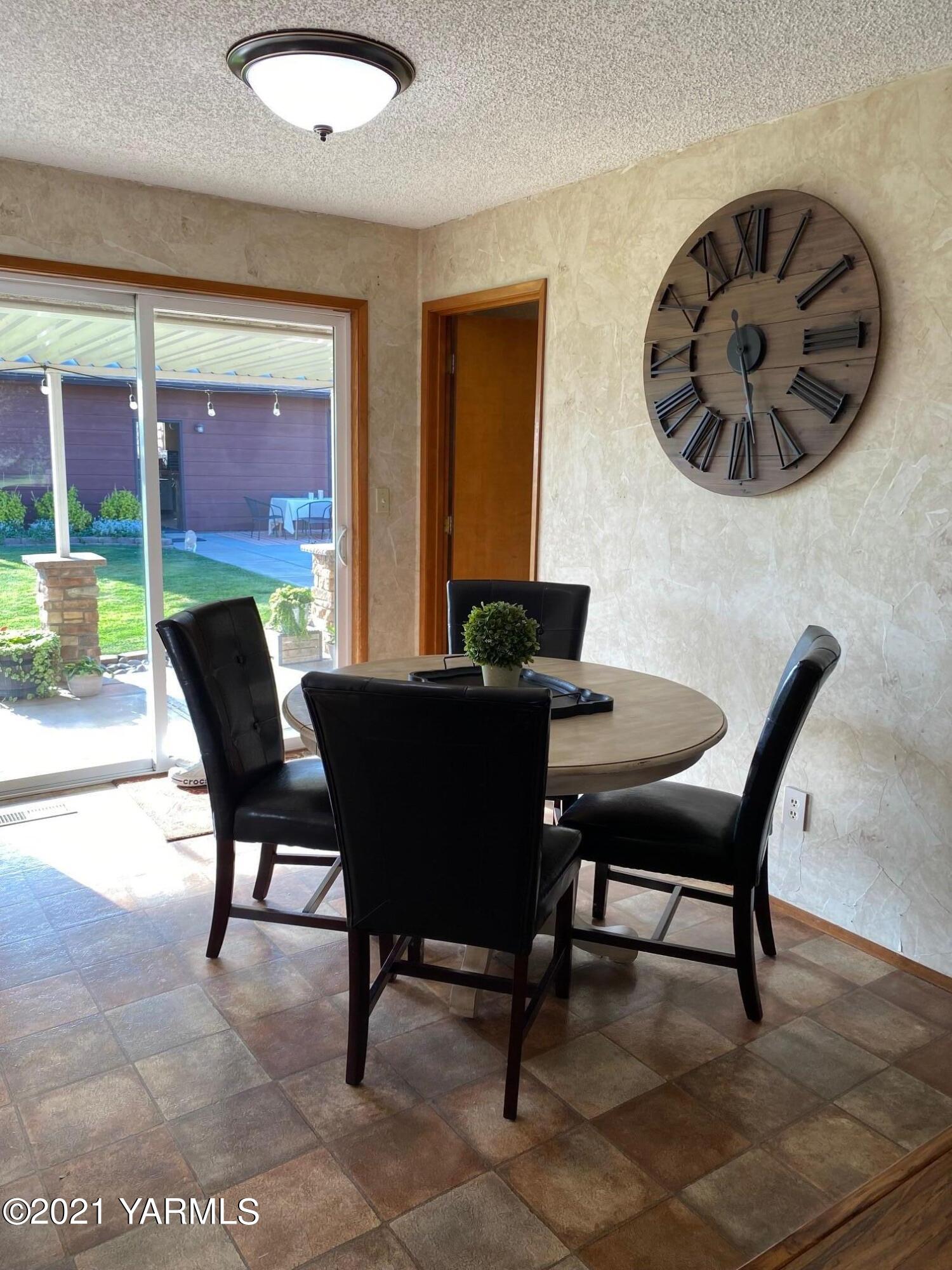 320 Bliss Road Zillah, WA 98953 - Photo 6 of 33 a view of a dining room with furniture window and outside view