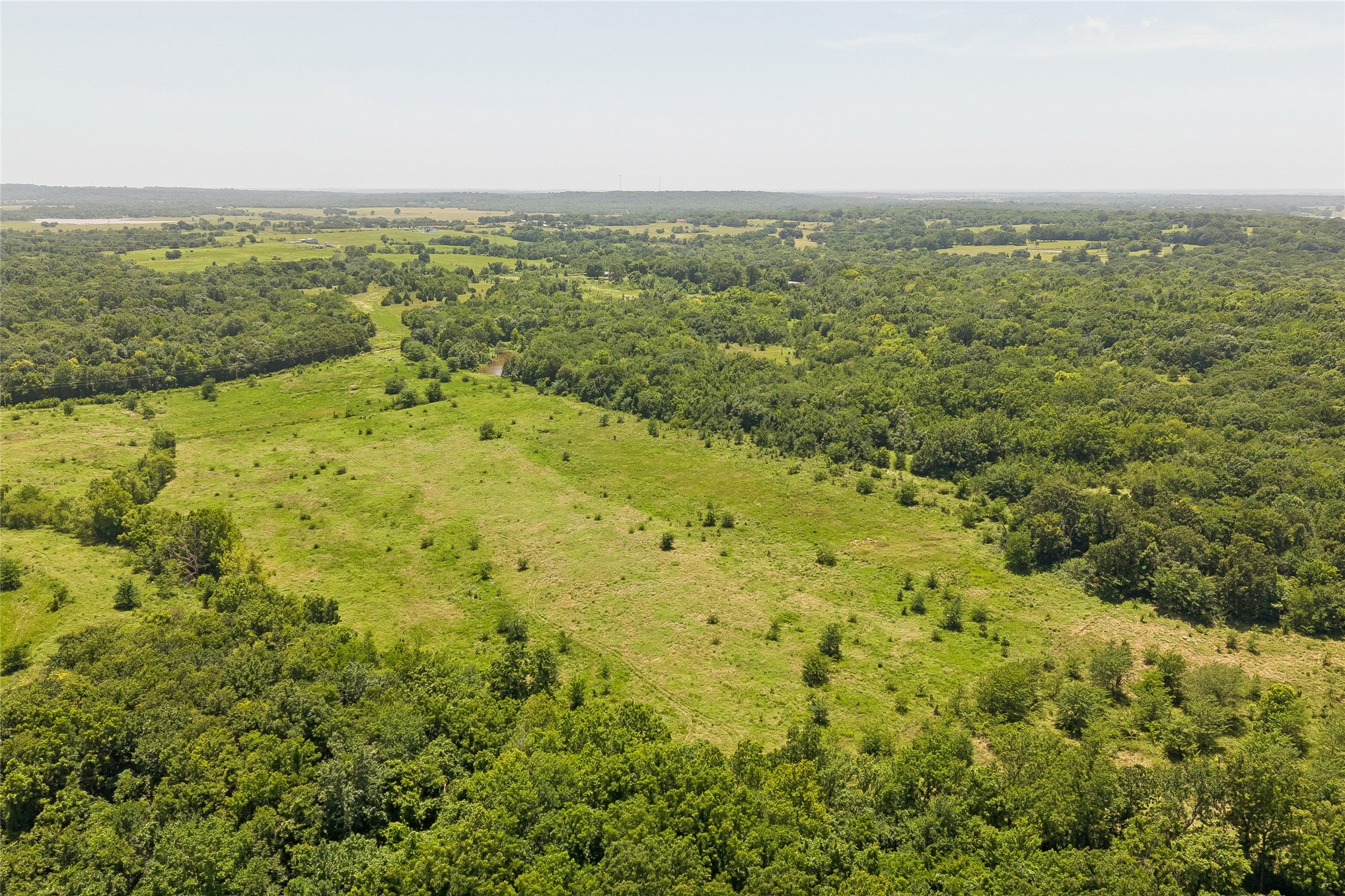2 West Fern Mountain Road Muskogee, OK 74401 - Photo 20 of 55 Expansive acreage featuring mature trees and open grasslands