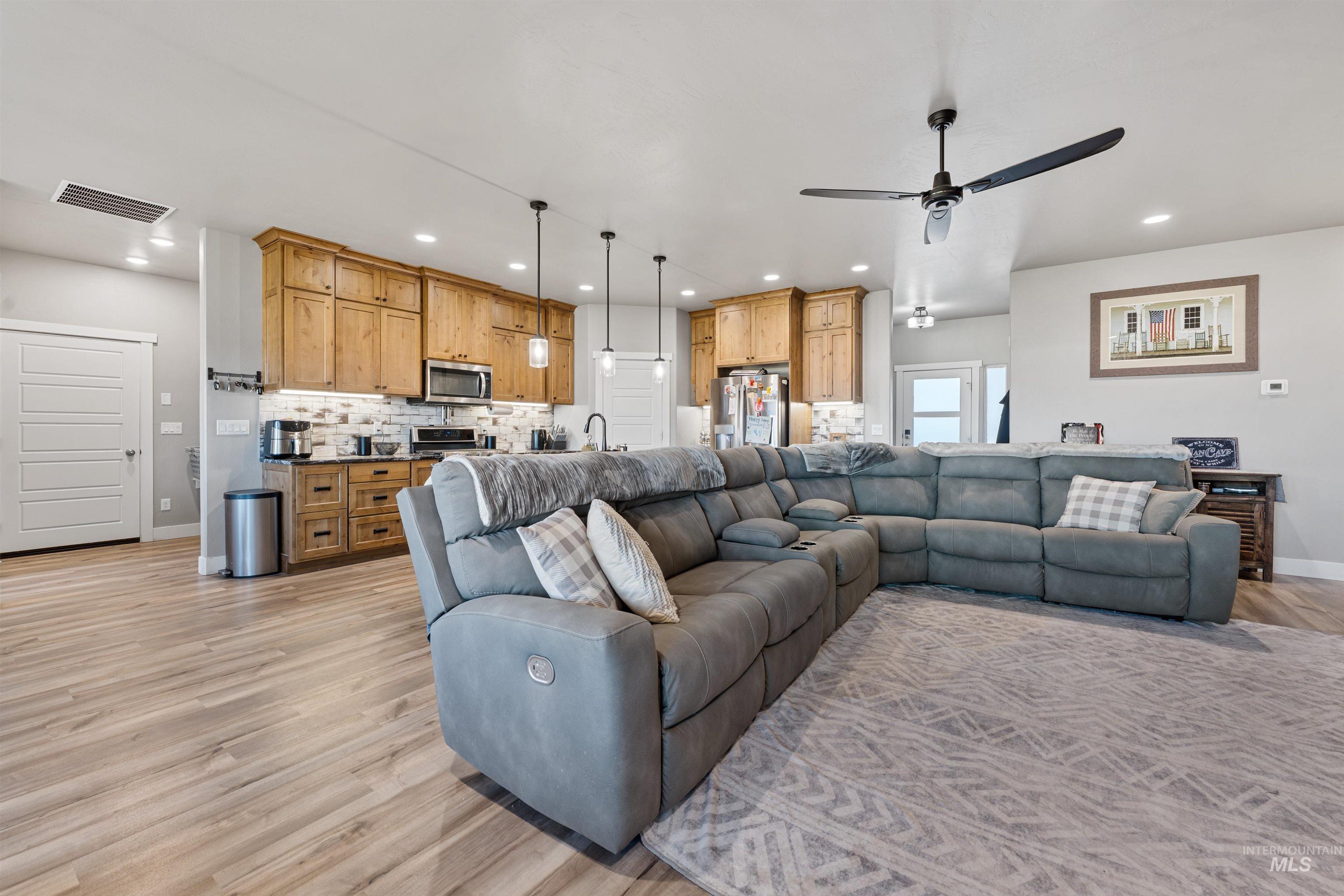 1005 Kenbrook Loop Twin Falls, ID 83301 - Photo 5 of 47 Living room with ceiling fan, light wood-style flooring, and recessed lighting