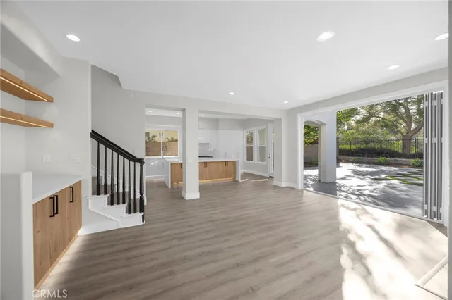 a view of an entryway with wooden floor