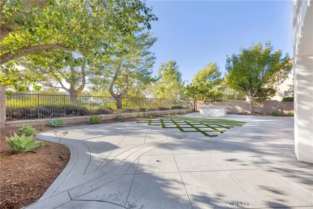 a bathroom with a toilet a sink a mirror and vanity