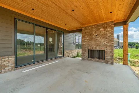 a view of empty room with floor to ceiling window