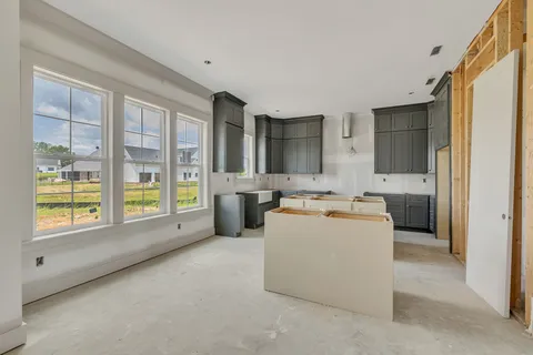 a view of a kitchen with refrigerator and yard