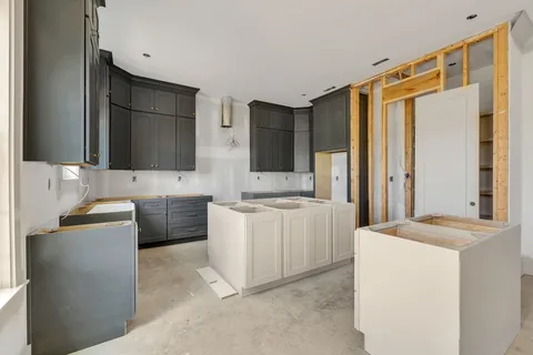 a kitchen with a sink stove and refrigerator